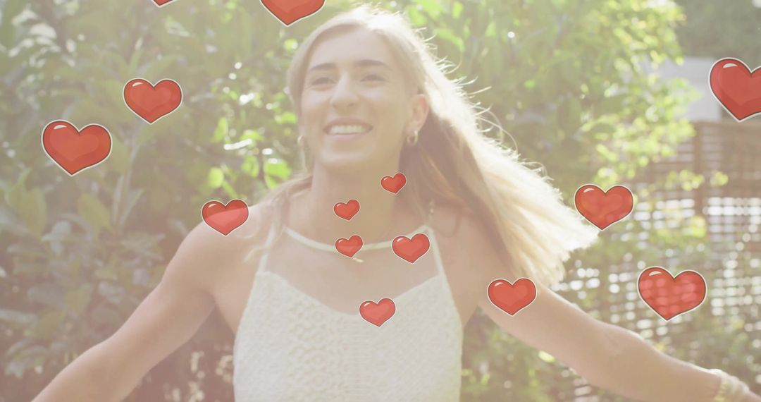Joyful Bride Dancing Amid Floating Hearts in Sunlit Garden