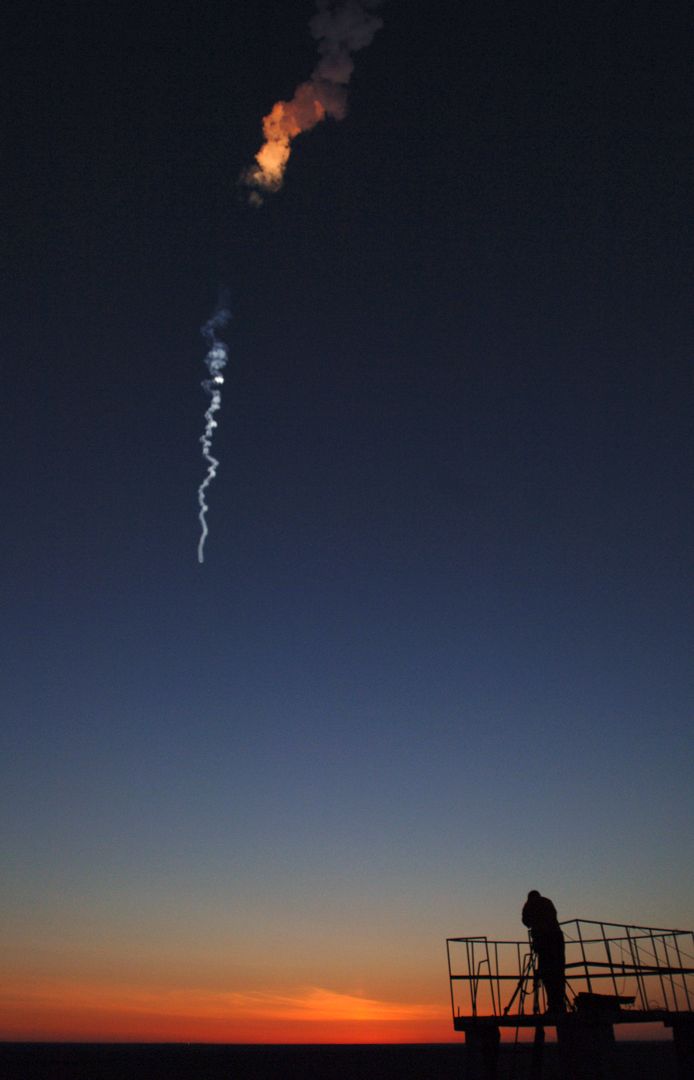 Rocket Launch at Dawn with Silhouette of Photographer, Baikonur Cosmodrome - Free Images, Stock Photos and Pictures on Pikwizard.com