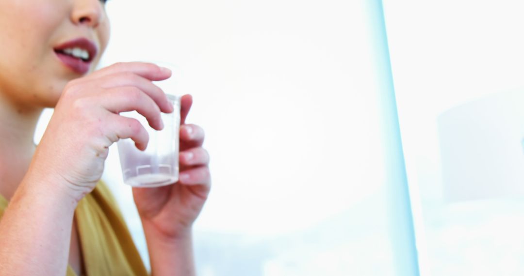 Woman Taking Medication for Health Management - Free Images, Stock Photos and Pictures on Pikwizard.com