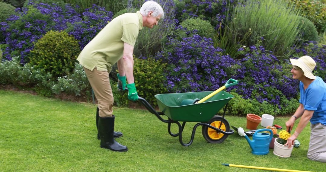 Elderly Man and Woman Gardening Together in Vibrant Flower Garden - Free Images, Stock Photos and Pictures on Pikwizard.com