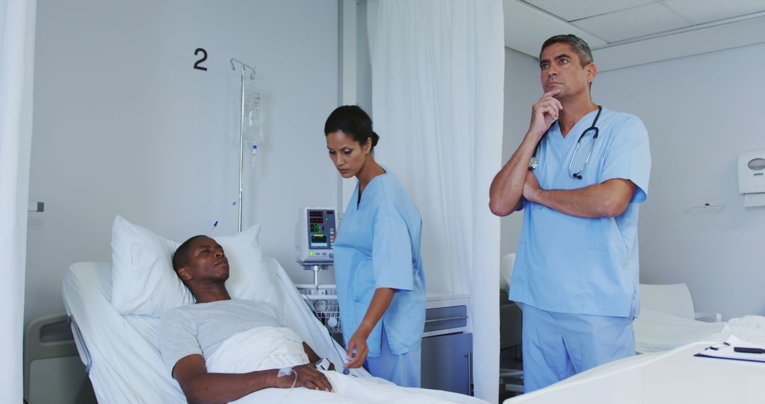 Medical Team Checking on Patient in Hospital Room - Free Images, Stock Photos and Pictures on Pikwizard.com