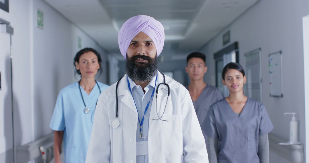 Diverse Medical Team Walking in Hospital Corridor - Free Images, Stock Photos and Pictures on Pikwizard.com