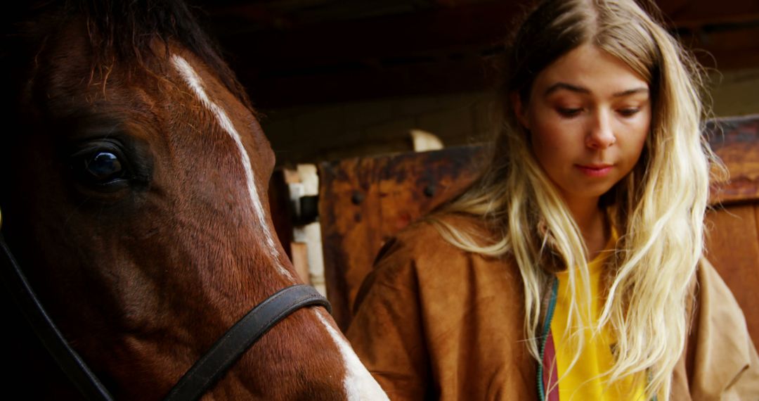 Woman Caring for Horse in Stable and Bonding with Animal - Free Images, Stock Photos and Pictures on Pikwizard.com