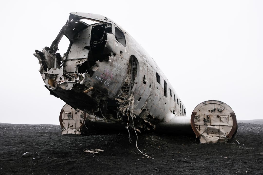 Abandoned plane crash wreck in iceland on black sand beach
