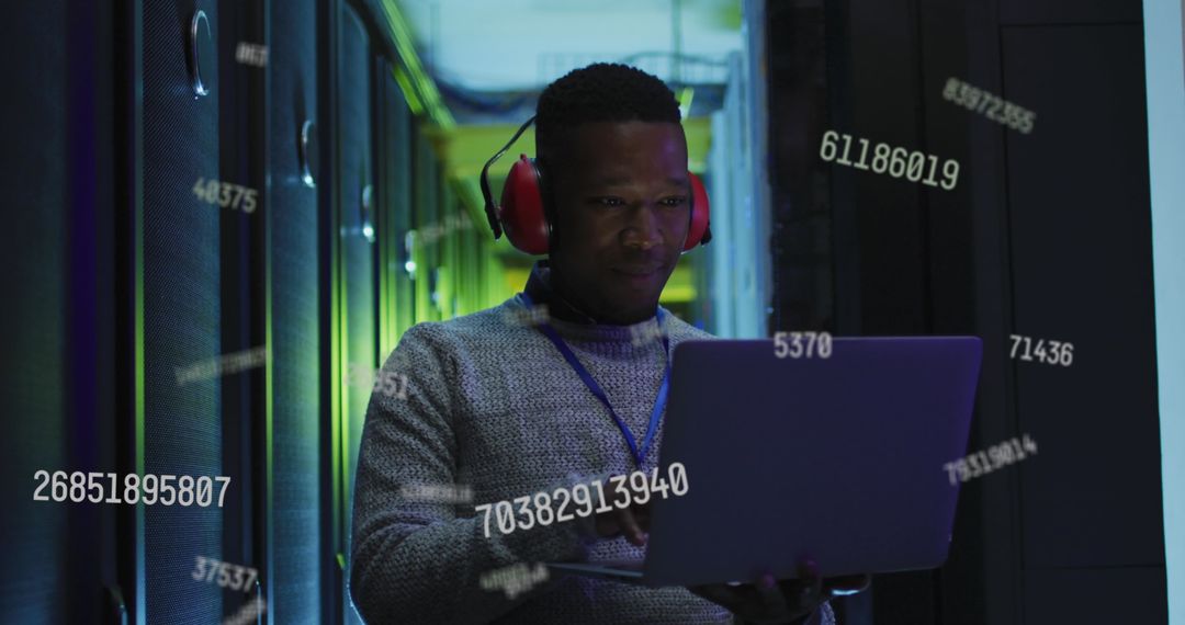 African American IT Engineer at Work in Server Room