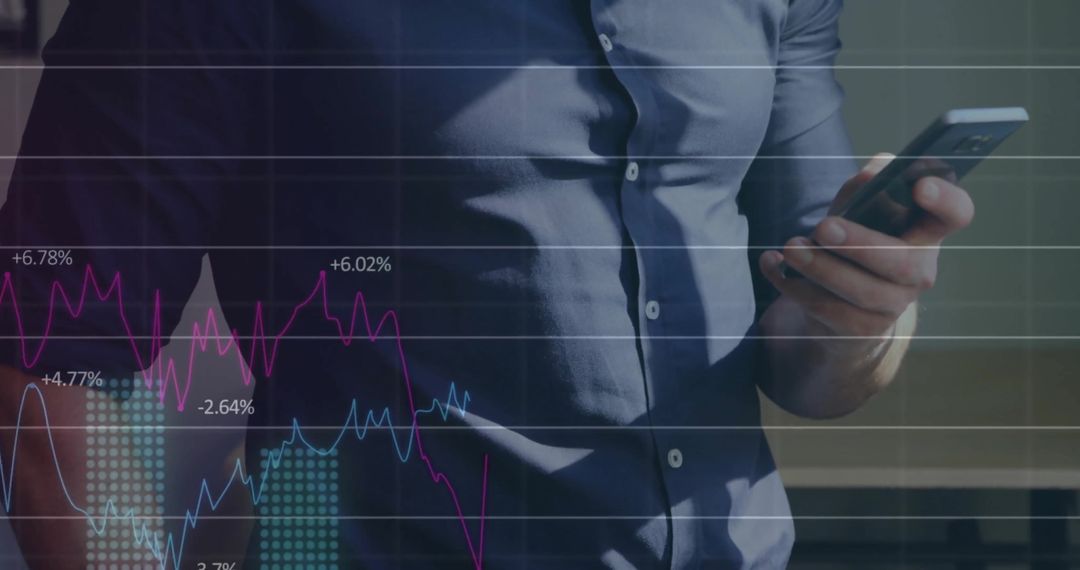 Businessman Engaging with Financial Data on Smartphone