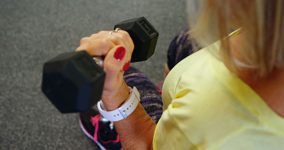 Senior Woman Lifting Dumbbell in Gym - Free Images, Stock Photos and Pictures on Pikwizard.com