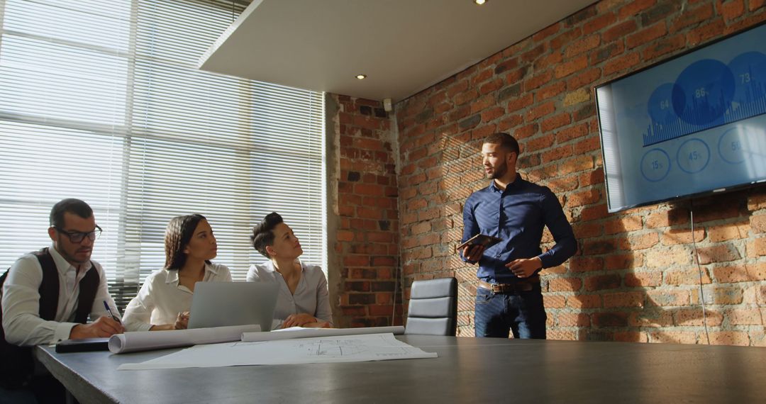 Business Meeting Presentation in Modern Brick-Walled Office - Free Images, Stock Photos and Pictures on Pikwizard.com