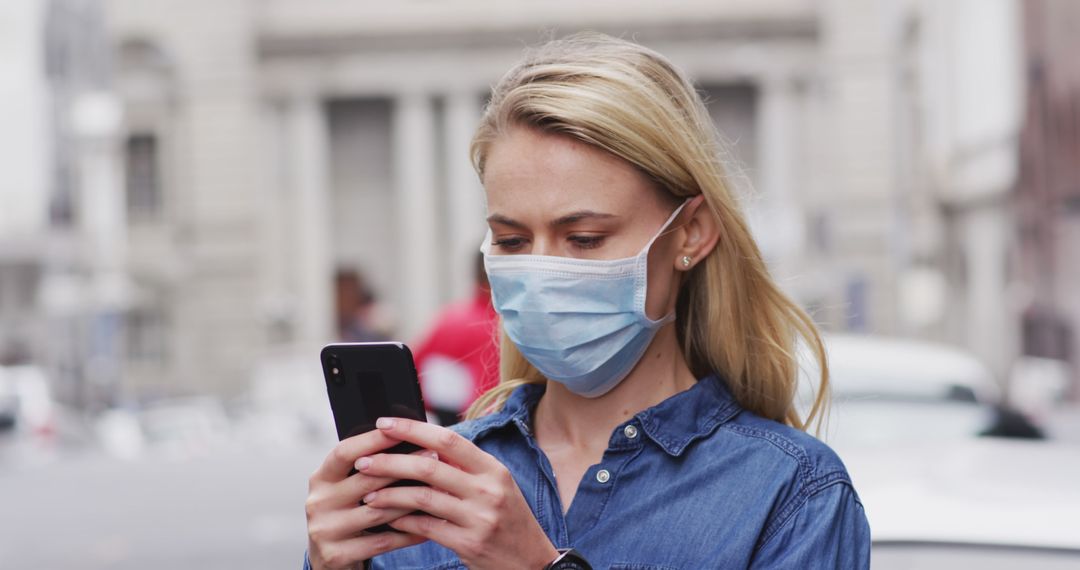 Young Woman Wearing Mask Texting on Smartphone Outdoors - Free Images, Stock Photos and Pictures on Pikwizard.com