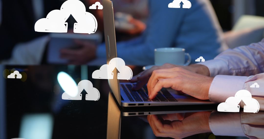 Businessman Typing with Cloud Computing Graphics Overlay