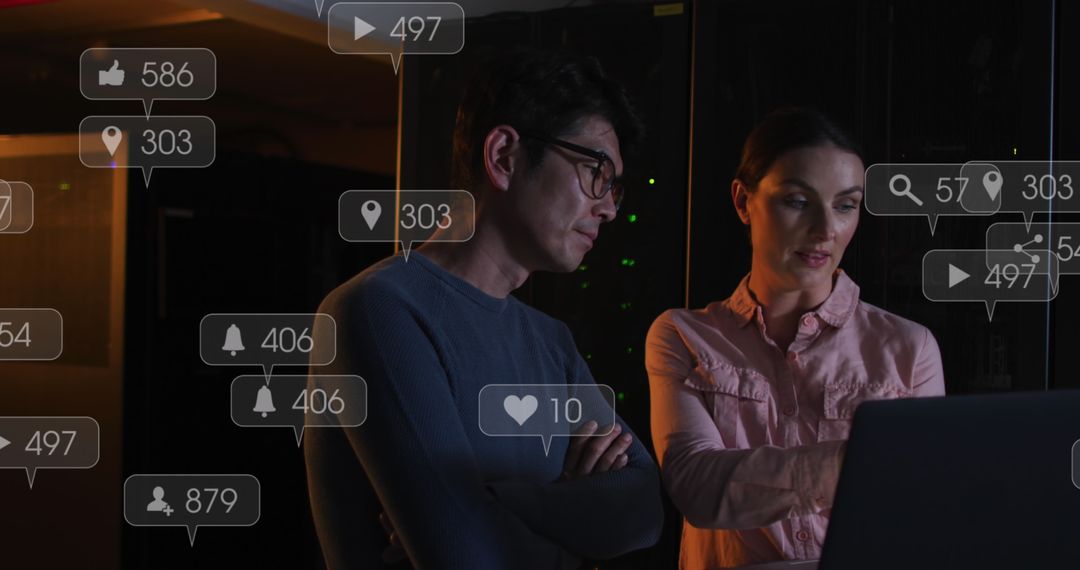 IT Technicians Analyzing Data on Laptops with Social Media Overlay