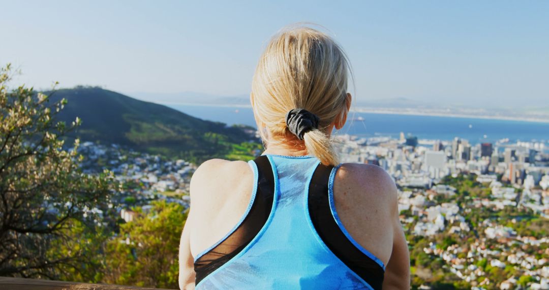 Woman Overlooking Cityscape After Exercise - Free Images, Stock Photos and Pictures on Pikwizard.com