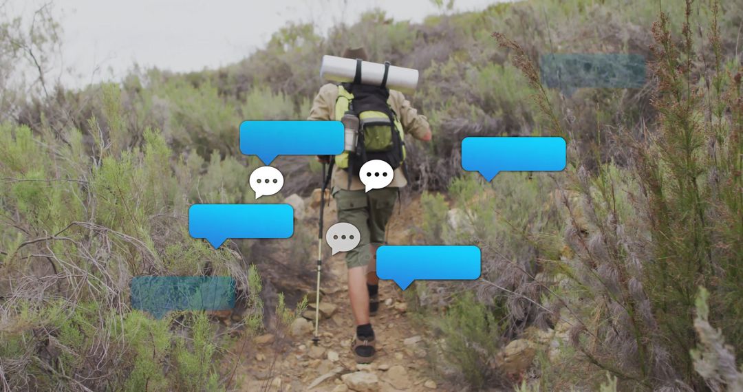 Hiker Trekking Uphill with Virtual Chat Bubbles Concept