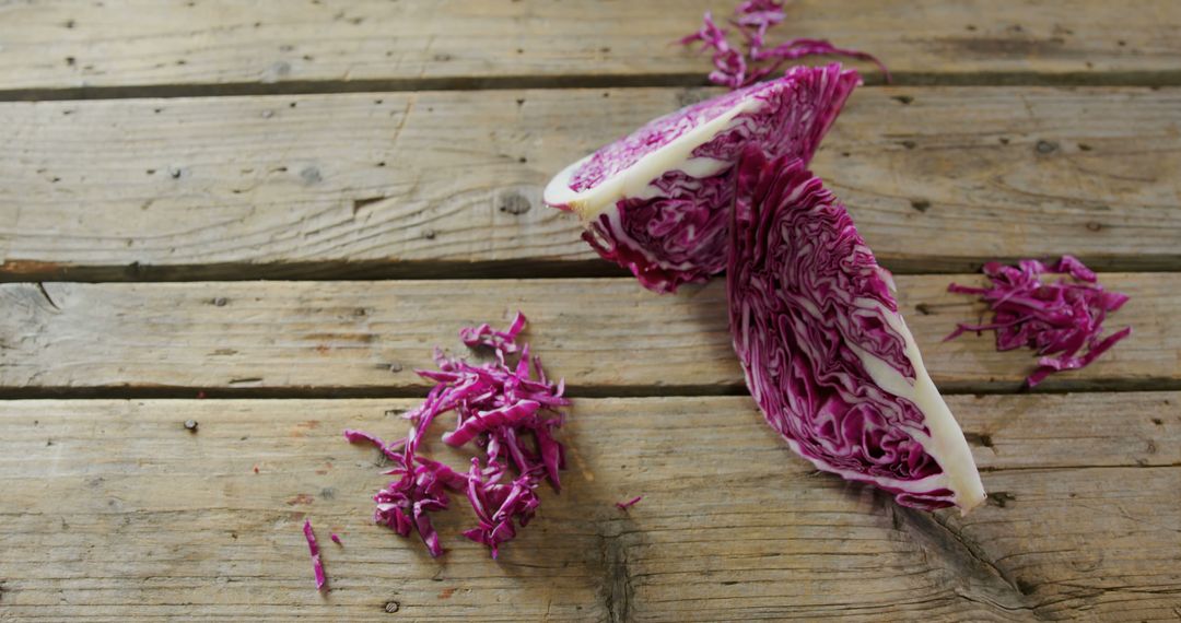 Freshly Cut Purple Cabbage on Rustic Wooden Table - Free Images, Stock Photos and Pictures on Pikwizard.com