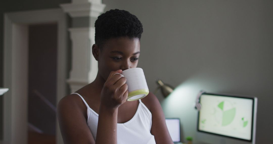 Woman Enjoying Coffee in Modern Home Office - Free Images, Stock Photos and Pictures on Pikwizard.com