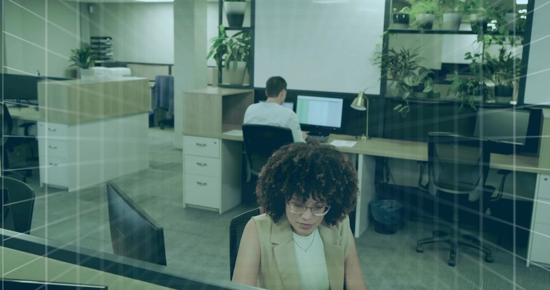 Modern Open Office with Professional Workers and Greenery