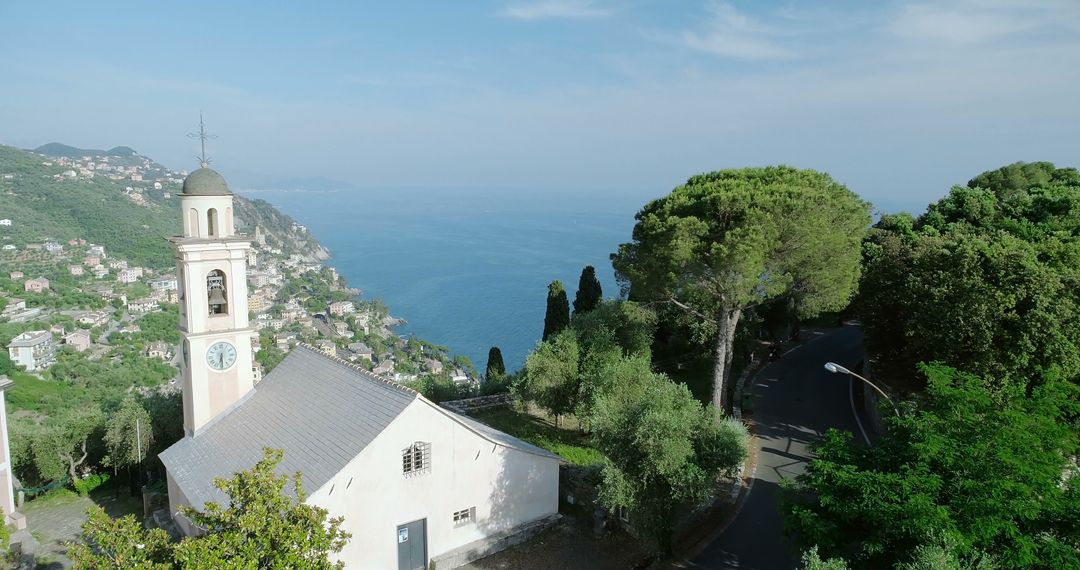 Picturesque Cliffside Church Overlooking Serene Coastal Sea - Free Images, Stock Photos and Pictures on Pikwizard.com