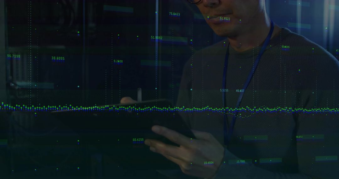IT Professional Analyzing Data on Tablet in Server Room