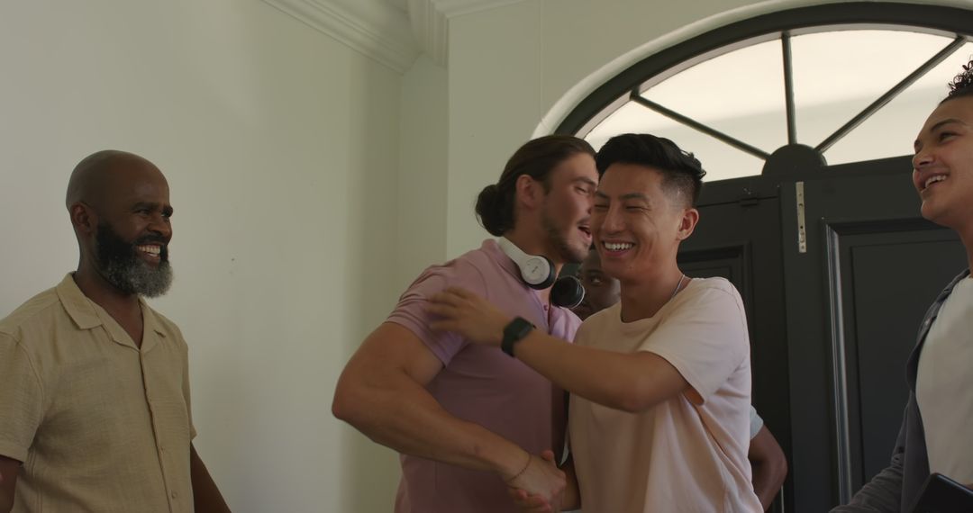 Friends Smiling and Greeting with High Fives Indoors