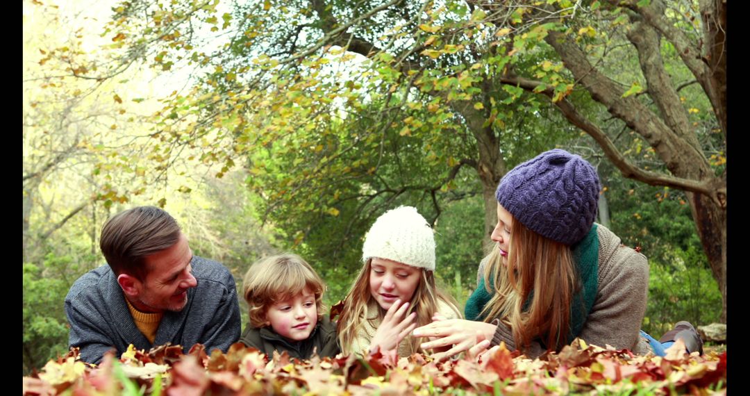 Family Enjoying Autumn Leaves in Park - Free Images, Stock Photos and Pictures on Pikwizard.com