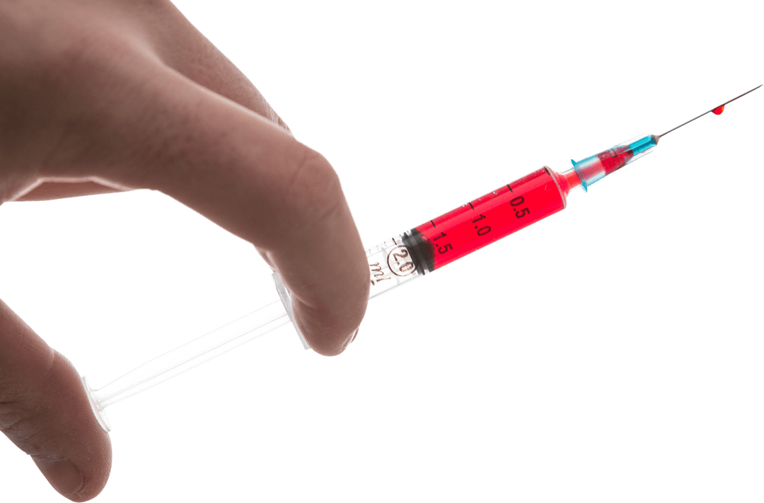 Hand Holding Transparent Syringe With Red Liquid