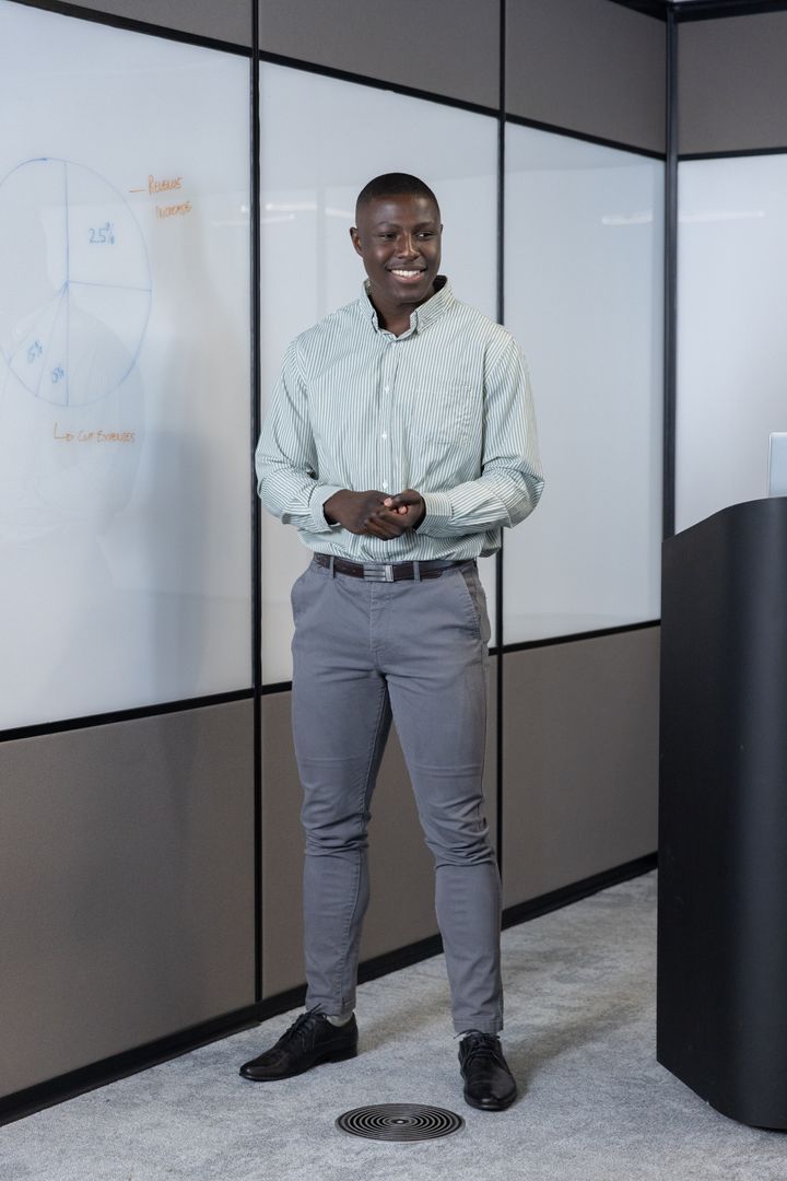 Confident Business Presentation with Pie Chart in Modern Meeting Room