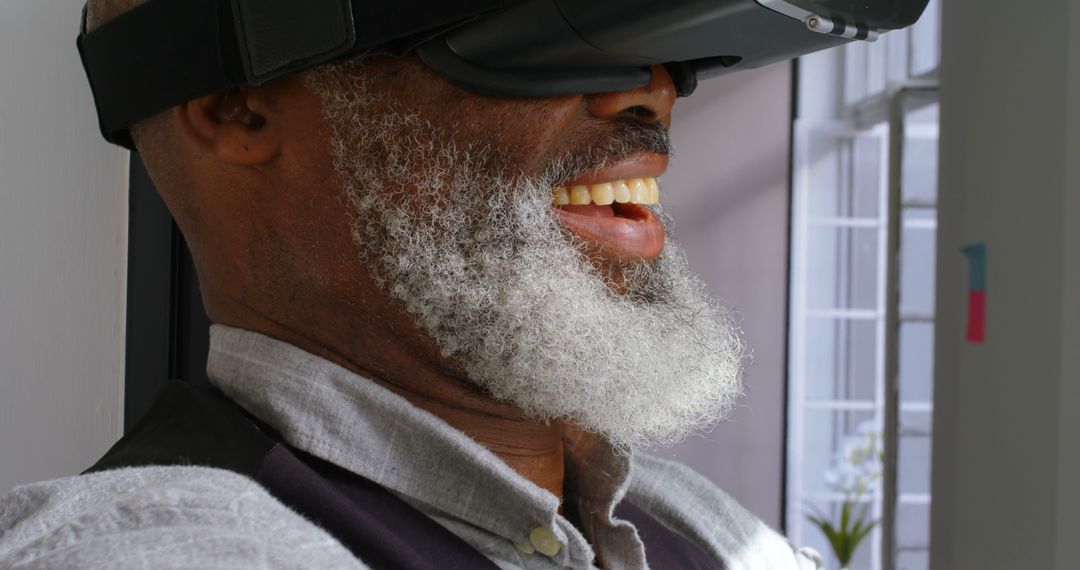 Senior Man with White Beard Enjoying Virtual Reality Headset - Free Images, Stock Photos and Pictures on Pikwizard.com