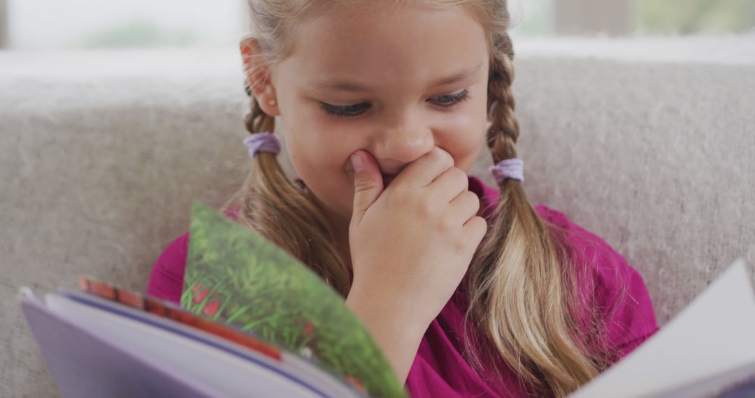 Curious Young Girl Reading Storybook with Interest - Free Images, Stock Photos and Pictures on Pikwizard.com