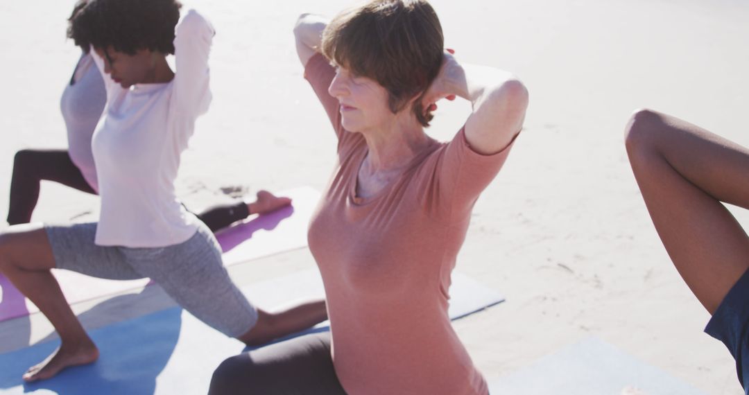 Diverse Women Practicing Yoga Together on Sunny Beach - Free Images, Stock Photos and Pictures on Pikwizard.com