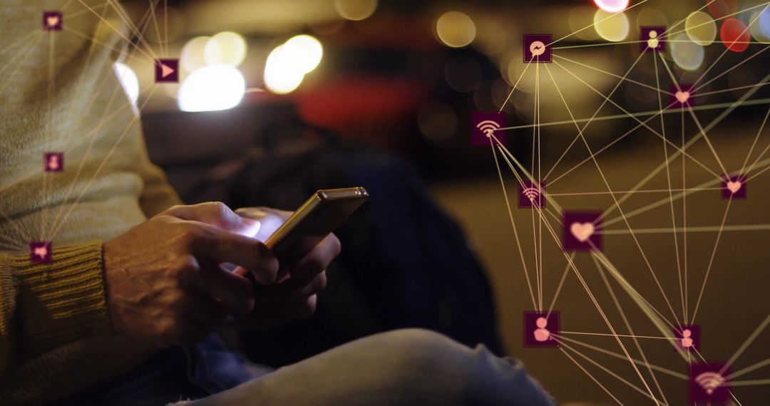 Person Using Smartphone Connected to Global Network at Night