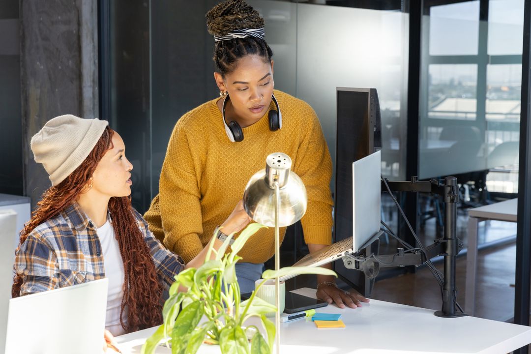 Diverse Female Team Collaborating in Creative Workspace