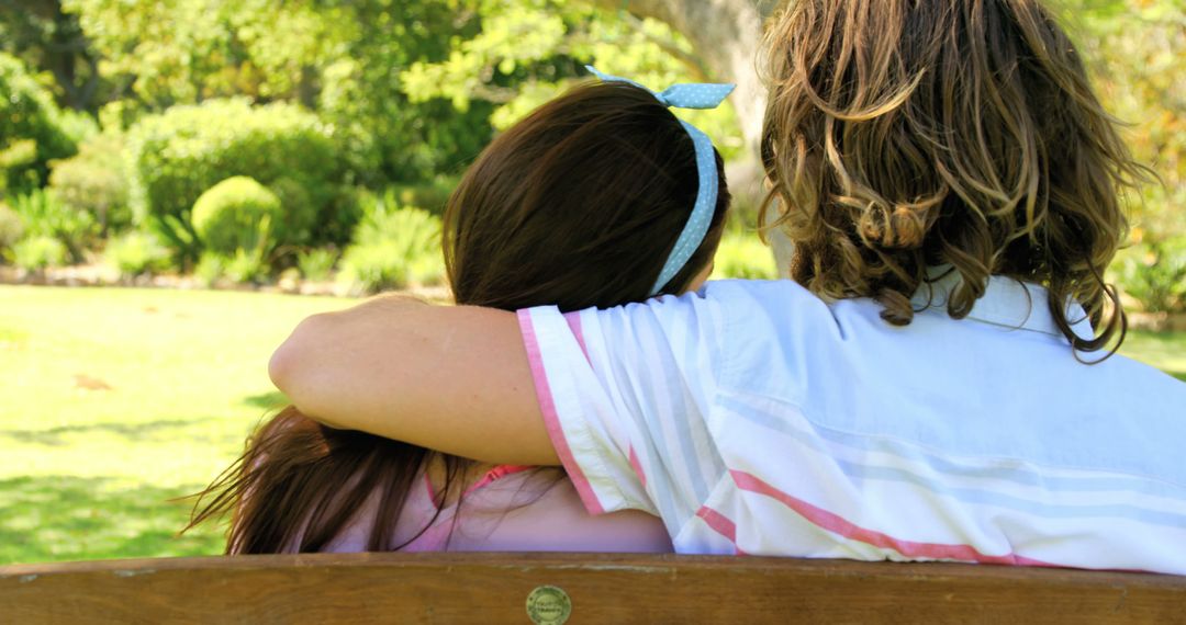 Couple Embracing on Park Bench in Sunny Park - Free Images, Stock Photos and Pictures on Pikwizard.com