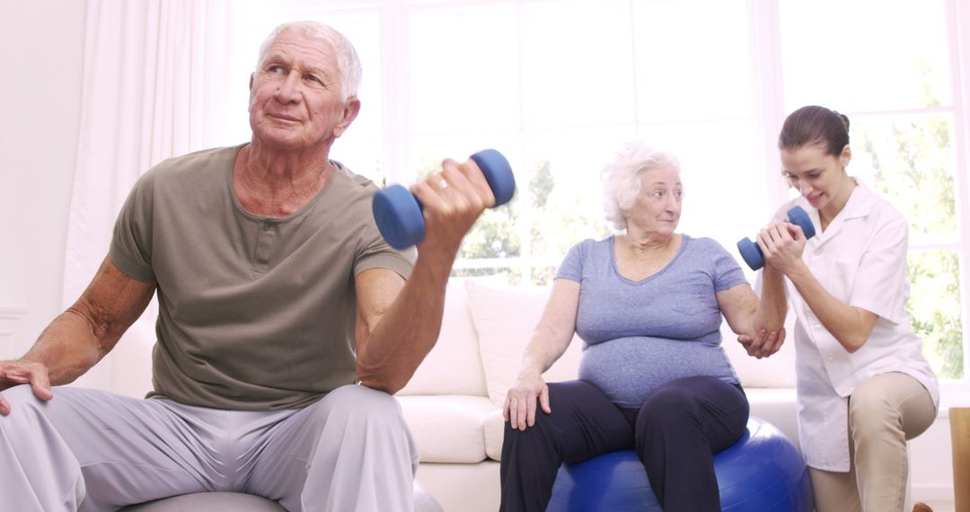 Senior Men and Women Exercising with Dumbbells at Home - Free Images, Stock Photos and Pictures on Pikwizard.com