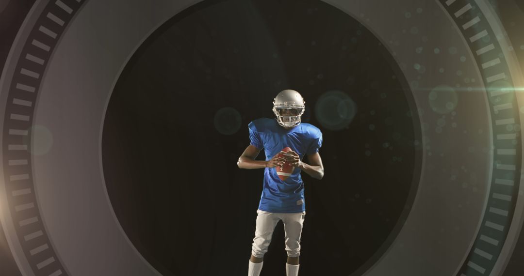 American Football Player Holding Ball in Spotlight with Dramatic Background - Free Images, Stock Photos and Pictures on Pikwizard.com