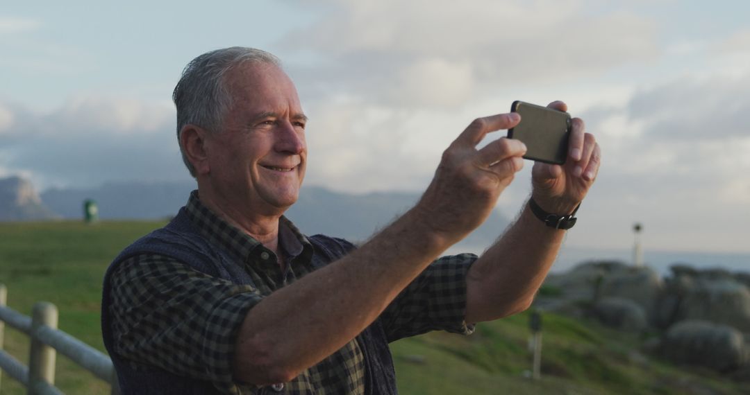 Senior Man Taking Selfie with Smartphone Outdoors in Nature - Free Images, Stock Photos and Pictures on Pikwizard.com