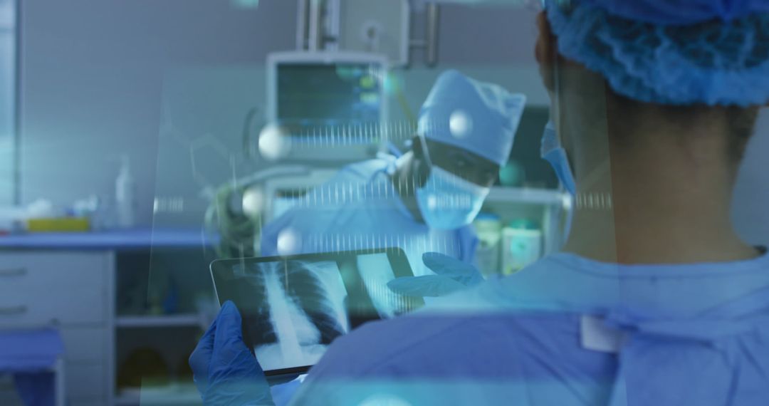 Doctors Reviewing Digital X-Rays During Surgery in High-Tech Operating Room