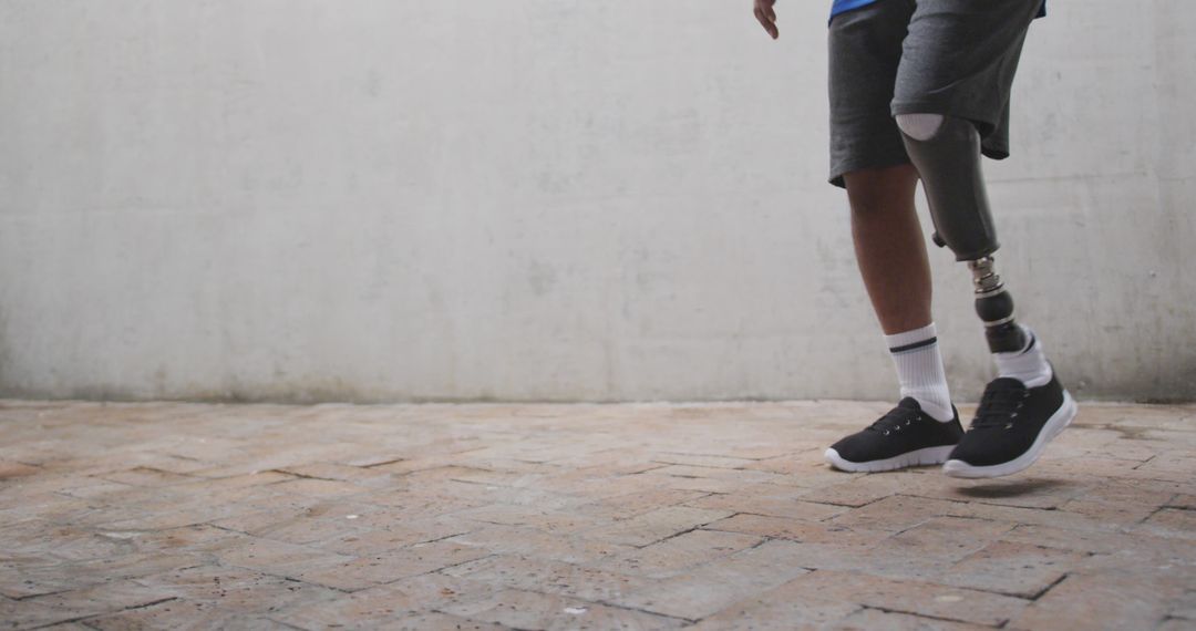 Close-Up of Young Man with Prosthetic Leg Walking Outdoors - Free Images, Stock Photos and Pictures on Pikwizard.com