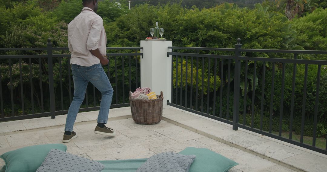Man Preparing Patio for Outdoor Wedding Reception
