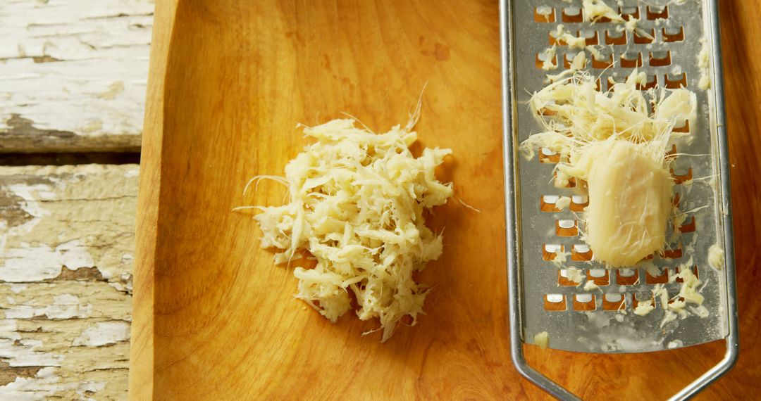 Close Up of Fresh Grated Ginger on Rustic Wood Surface - Free Images, Stock Photos and Pictures on Pikwizard.com