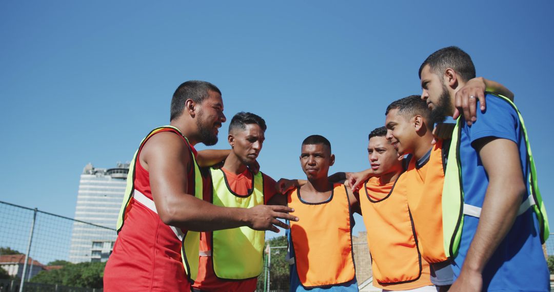 Young Men Huddling During Outdoor Team Sports Discussion - Free Images, Stock Photos and Pictures on Pikwizard.com