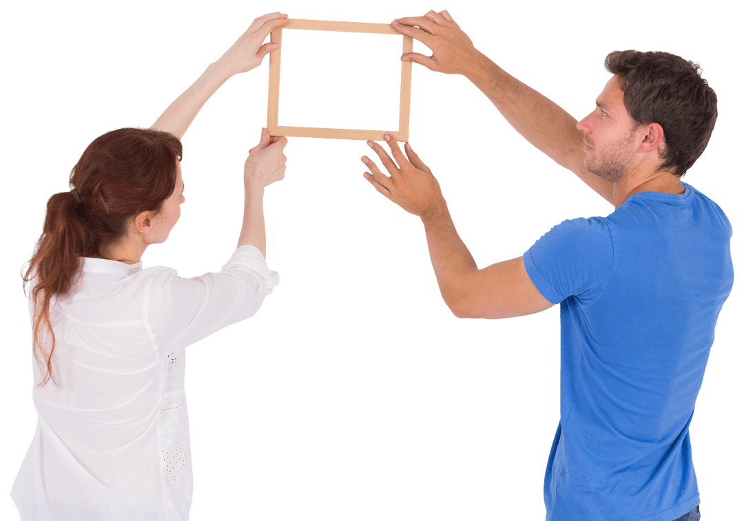 Couple Arranging Picture Frame on Transparent Background
