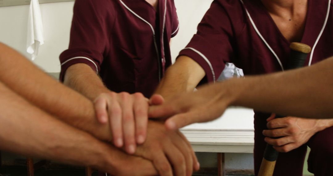 Sports Team Unity with Group Handshake in Locker Room - Free Images, Stock Photos and Pictures on Pikwizard.com