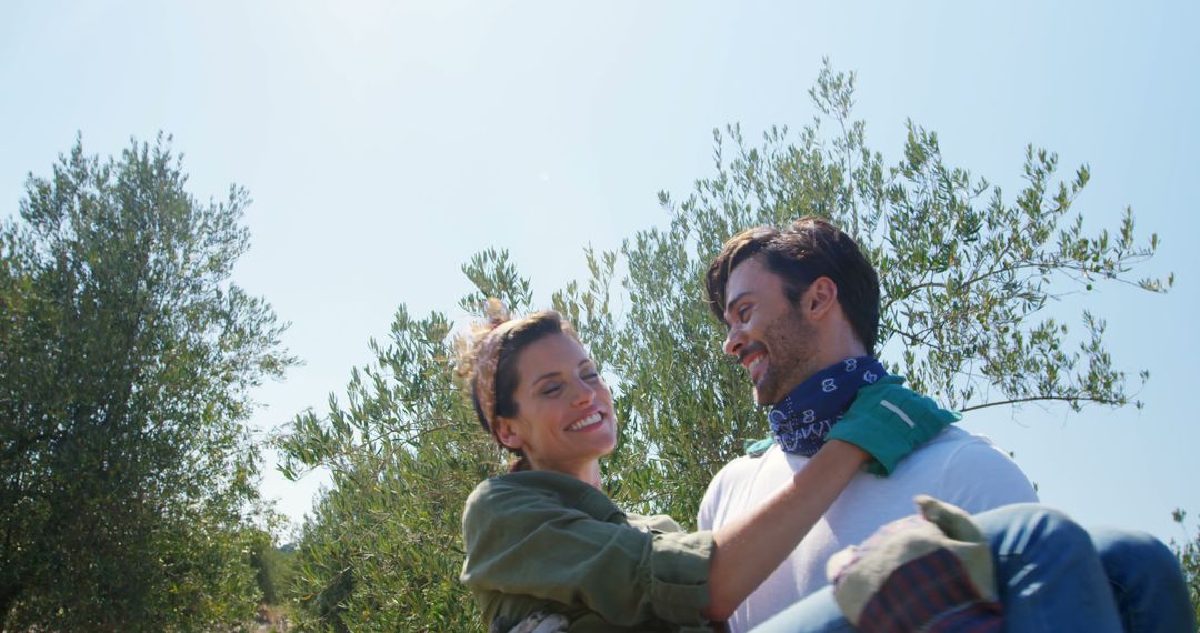 Joyful Couple Embracing on a Sunny Outdoor Adventure