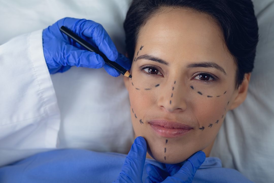 Surgeon Marking Woman's Face for Cosmetic Surgery - Free Images, Stock Photos and Pictures on Pikwizard.com