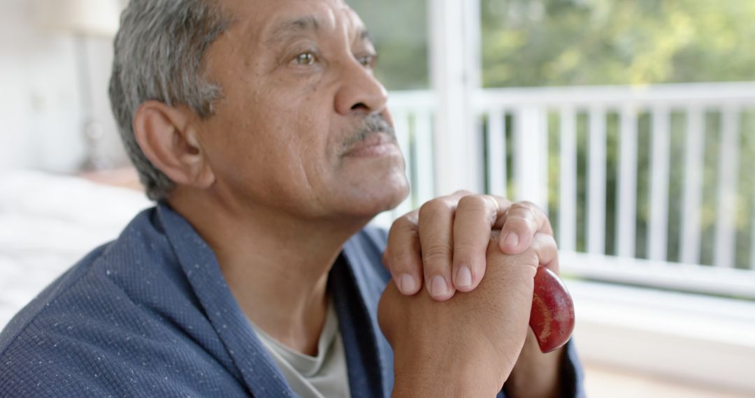 Senior Man Reflecting in a Peaceful Home Environment - Free Images, Stock Photos and Pictures on Pikwizard.com