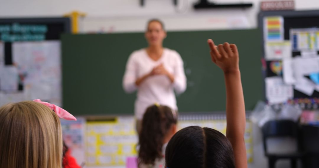 Student Raising Hand in Classroom - Free Images, Stock Photos and Pictures on Pikwizard.com