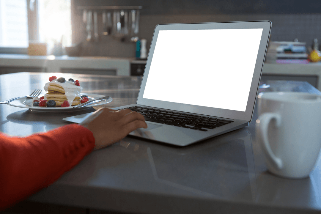 Transparent Editable Laptop Screen on Kitchen Counter for Mockup Design