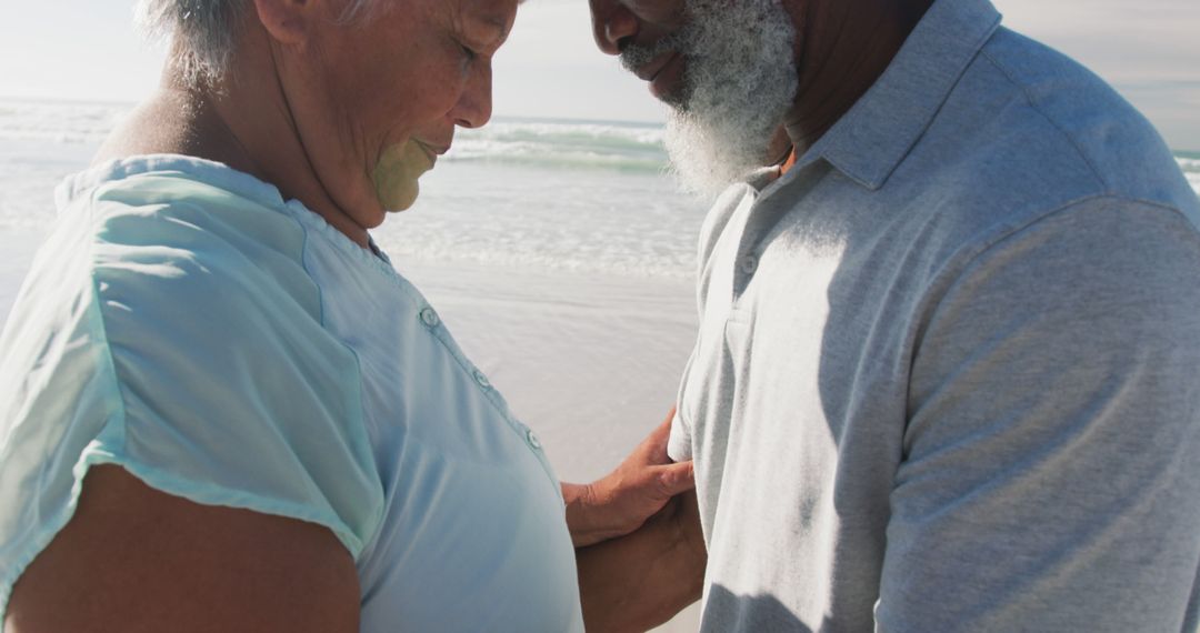 Senior Couple Embracing on Beach with Eyes Closed - Free Images, Stock Photos and Pictures on Pikwizard.com