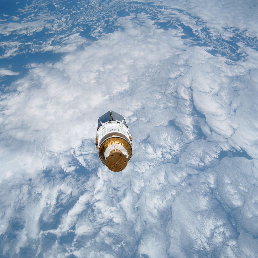 Tracking and Data Relay Satellite TDRS-E Over Cloud-Covered Earth, August 1991 - Free Images, Stock Photos and Pictures on Pikwizard.com