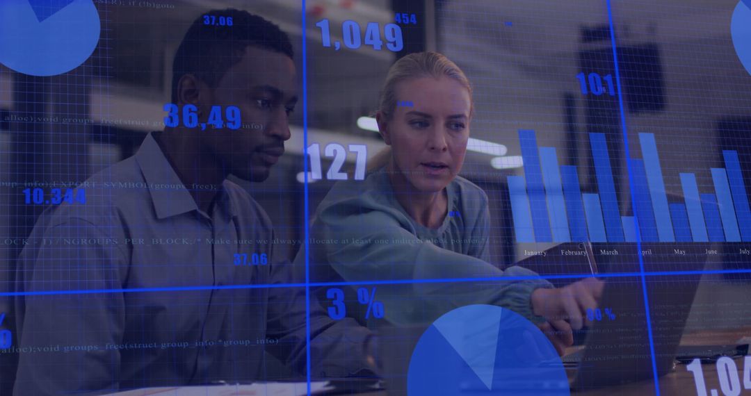 Collaborating Colleagues Analyzing Financial Data on Laptop